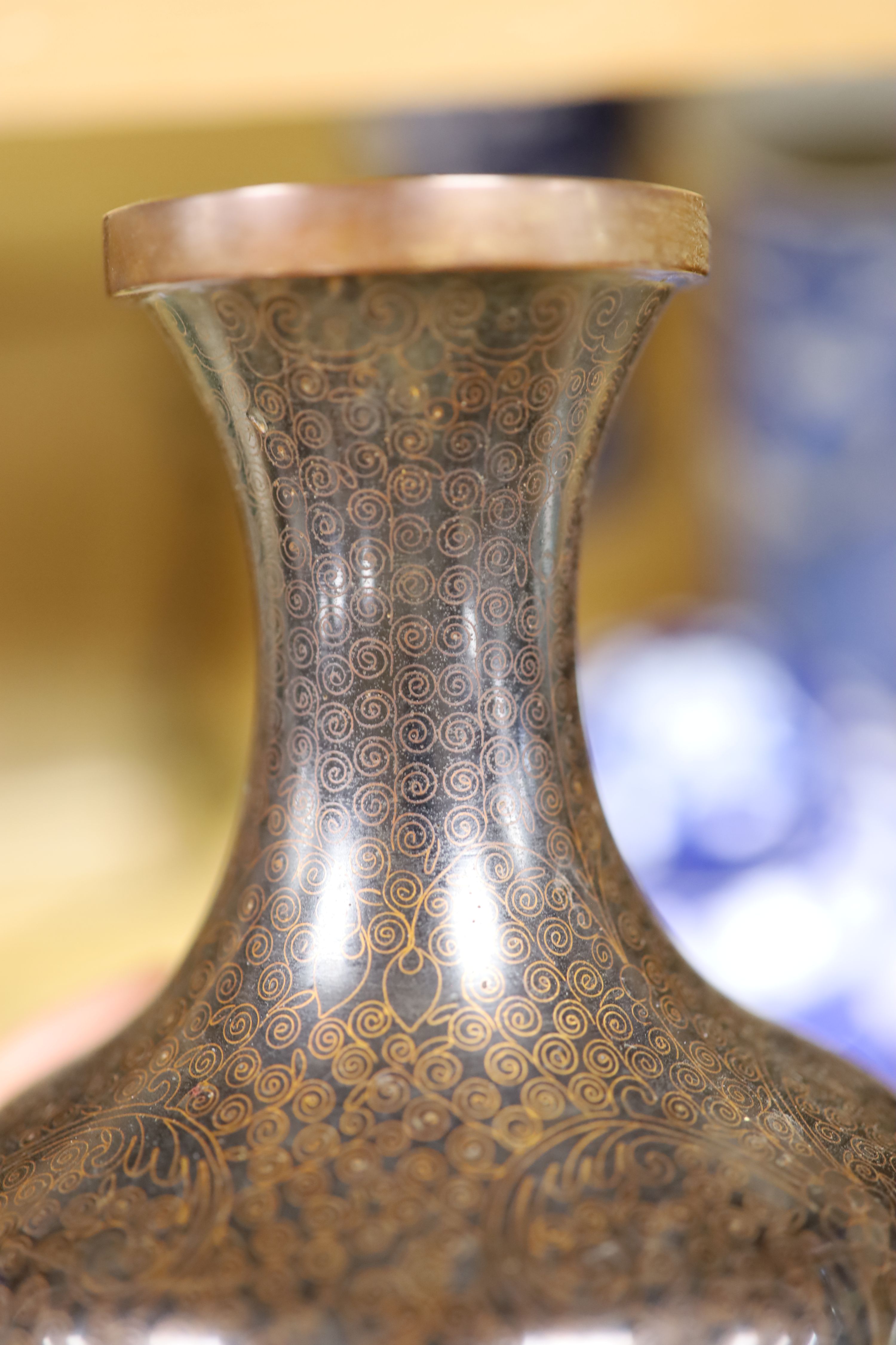 A Chinese blue and white cylindrical vase, another vase and cover and a blue and white jar and cover, together with a cloisonne vase and a bronze censer, tallest 32cm